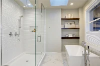 Sleek architectural corner surround showcasing seamless, grout-free solid-surface walls that optimize tight corner bathroom configurations