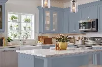 Minimalist heritage kitchen unit featuring flush-fitting decorative panels and a seamless, ergonomic design for a clutter-free look