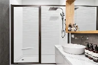 Sleek geometric alcove enclosure showcasing clean vertical lines and watertight corner joints that maximize compact showering space