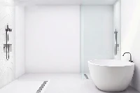 Minimalist zero-threshold surround station offering complete heavy-duty moisture protection and an uninterrupted transition to the basin floor