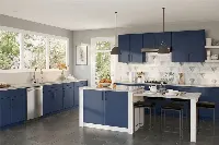 Minimalist linear kitchen storage featuring flush-front panels and an integrated aesthetic designed for a high-traffic, multi-functional living space