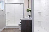 Minimalist space-optimizing surround unit offering high-impact moisture protection and a clean, uninterrupted visual flow across shared vanity and shower walls