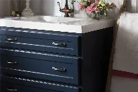 High-end granite vanity surface with a thick mitered edge and a sophisticated polished gray stone texture