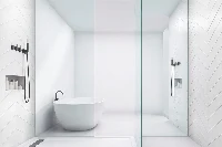 Sleek flush-mount shower surround showcasing a grout-free wall system designed to channel water efficiently into an exposed, wide-drain open basin
