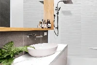 Minimalist back-to-wall surround station offering high-impact moisture protection and an ultra-clean, uninterrupted panel surface