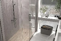 Modern walk-in panel surround featuring expansive, grout-free solid-surface panels designed specifically for doorless, barrier-free showering