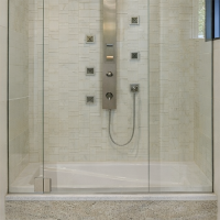 High-quality granite tub surround with glass enclosure for hotels