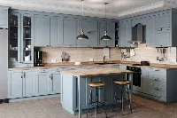 Minimalist three-wall cabinetry system featuring flush-front panels and a uniform, high-quality finish that optimizes corner storage