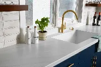 Modern integrated sink countertop featuring a seamless material transition from the solid surface directly into the built-in basin