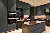 Sleek architectural cabinet system showcasing a continuous, handle-free facade that conceals major kitchen appliances