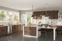 Sleek architectural kitchen island and cabinets showcasing an airy, minimalist layout and a uniform finish that flows into the surrounding interior