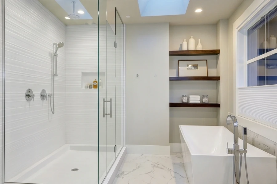 Sleek architectural corner surround showcasing seamless, grout-free solid-surface walls that optimize tight corner bathroom configurations