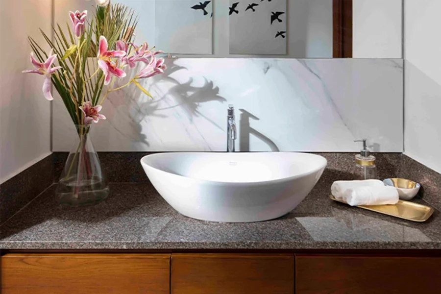 Modern classic countertop basin with a deep, rounded bowl and a high-gloss white ceramic finish.