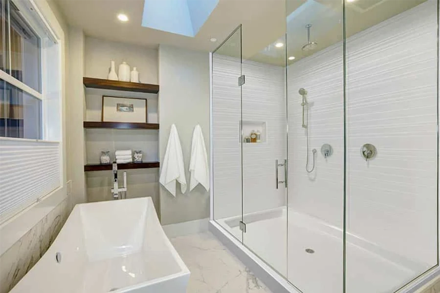 Modern corner-entry surround featuring a space-saving L-shaped panel layout designed specifically for angled, corner-access glass enclosures
