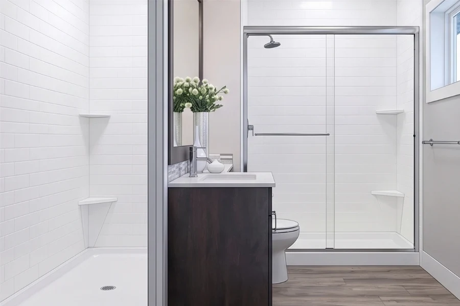 Contemporary connected shower surround with a sturdy monolithic panel design, engineered to eliminate tight gaps between the vanity cabinet and the splash zone