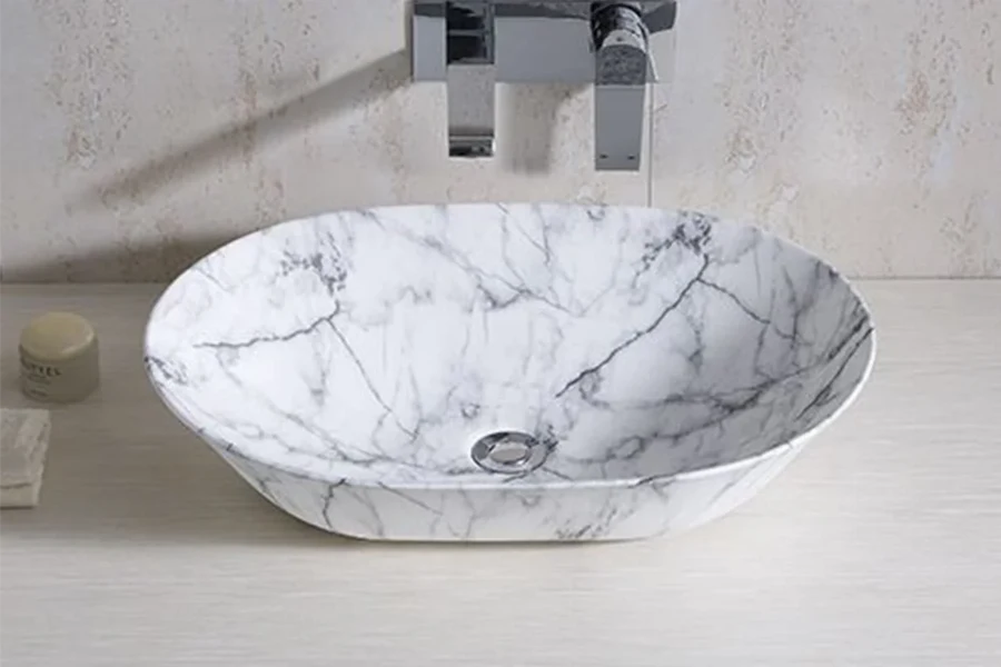 Modern round vessel sink featuring a tactile, hand-carved outer texture and a smooth interior basin