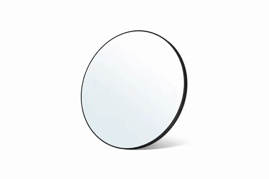 Contemporary minimal round mirror for an airy and sophisticated guest room vanity area