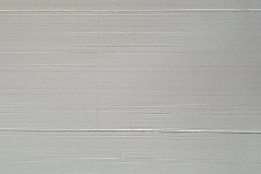 Modern horizontal line panel featuring an engineered solid-surface construction and a crisp, linear pattern that visually expands interior spaces