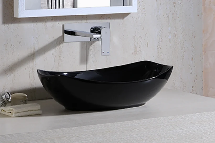 Modern round vessel sink with a sleek, thin-edged profile sitting atop a bathroom vanity