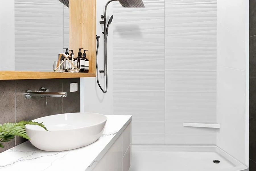 Modern minimal alcove surround featuring three seamless solid-surface panels engineered for a tight, grout-free three-wall recessed layout