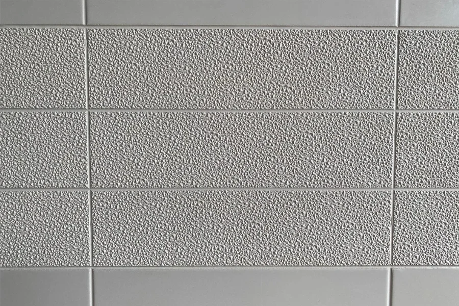 Modern fine grain surface panel featuring a high-density solid-surface build and a delicate, stippled texture that offers a sophisticated matte feel