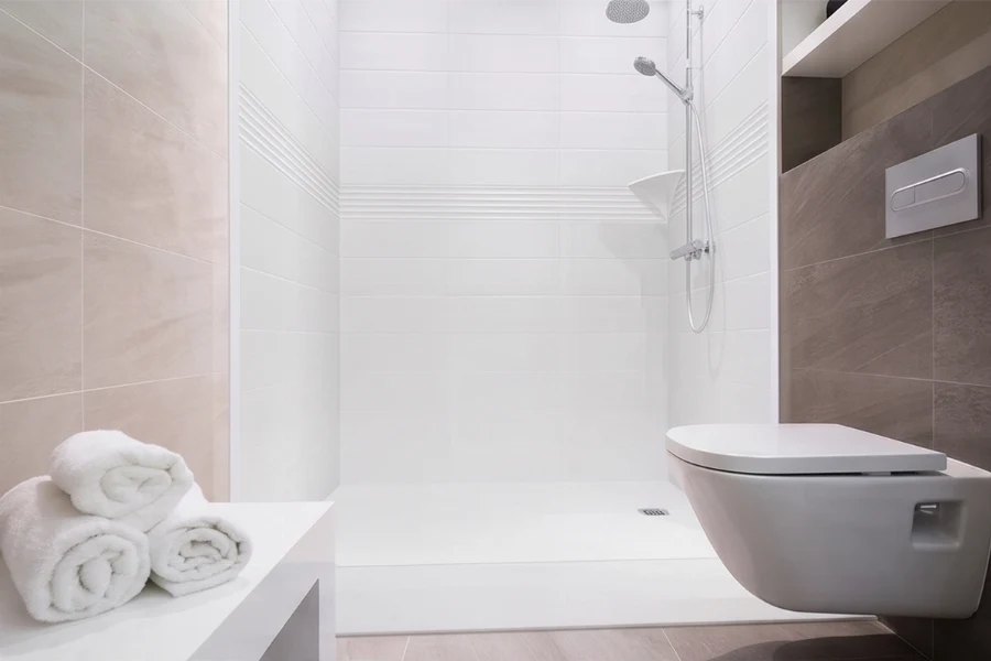 Contemporary low-profile surround unit with clean monolithic walls and a durable, scratch-resistant geometric silhouette