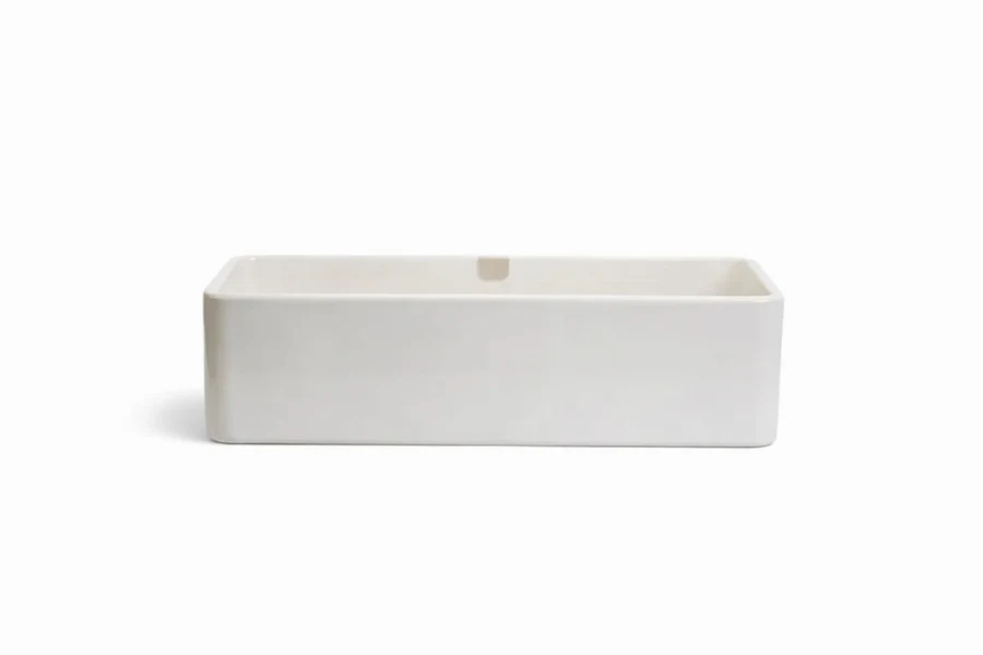 Sleek minimalist vanity with a built-in sink carved from a single continuous piece of matte stone