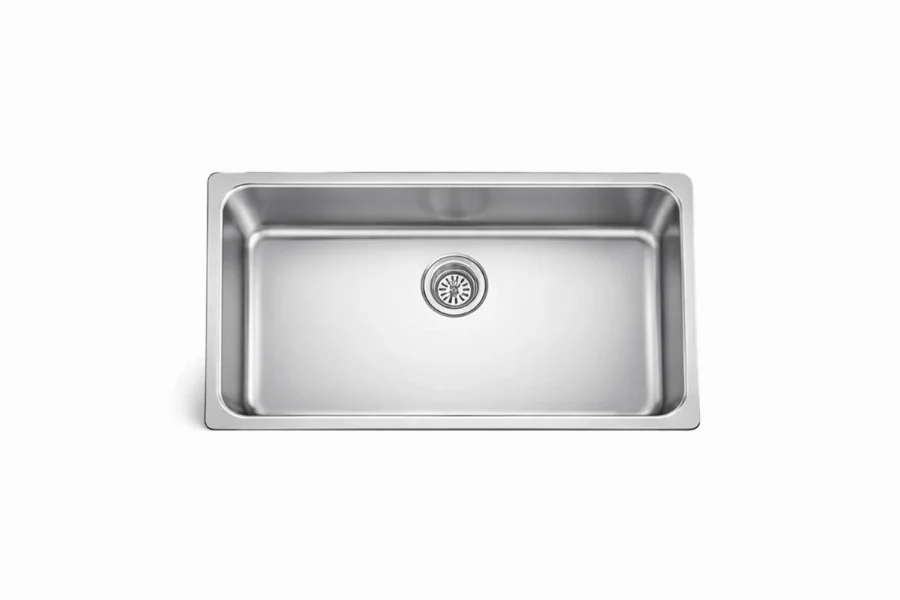 Industrial-style single bowl sink with a faceted interior base and a polished, brushed-metal finish