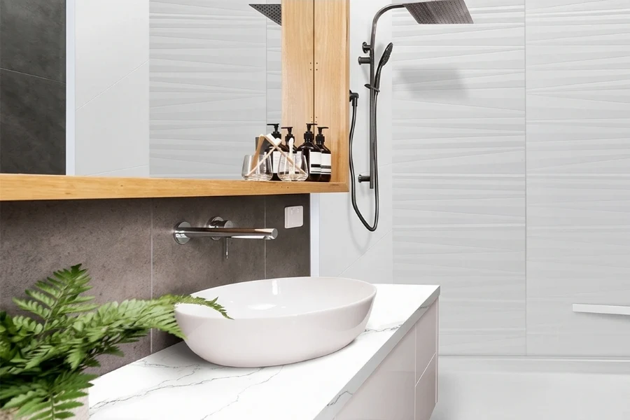 Minimalist back-to-wall surround station offering high-impact moisture protection and an ultra-clean, uninterrupted panel surface