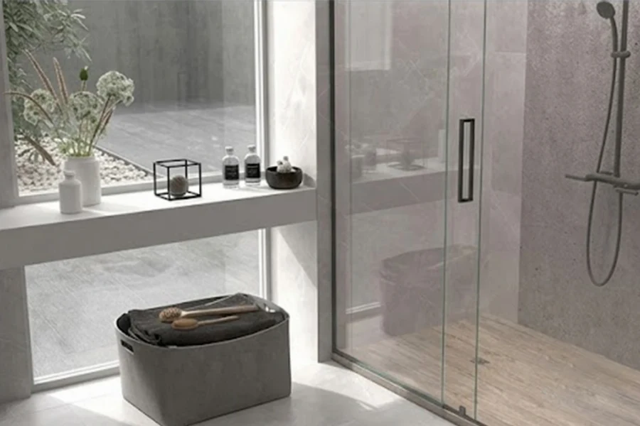 Sleek doorless-entry shower surround showcasing seamless architectural walls that easily accommodate long, splash-prone walk-in layouts