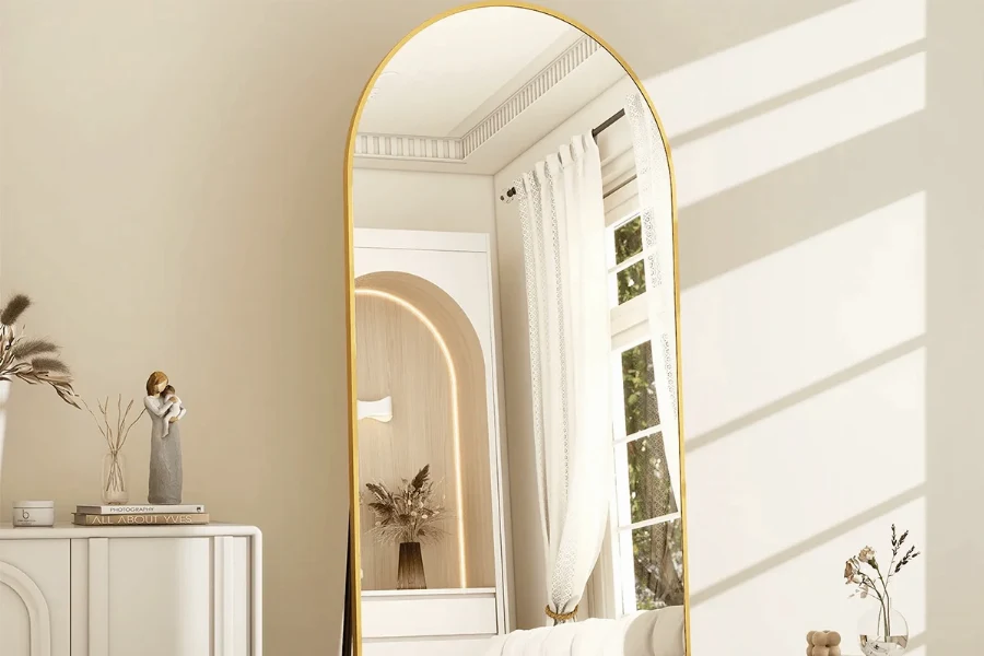 Modern arched floor mirror with a sleek metal frame for hotel suites