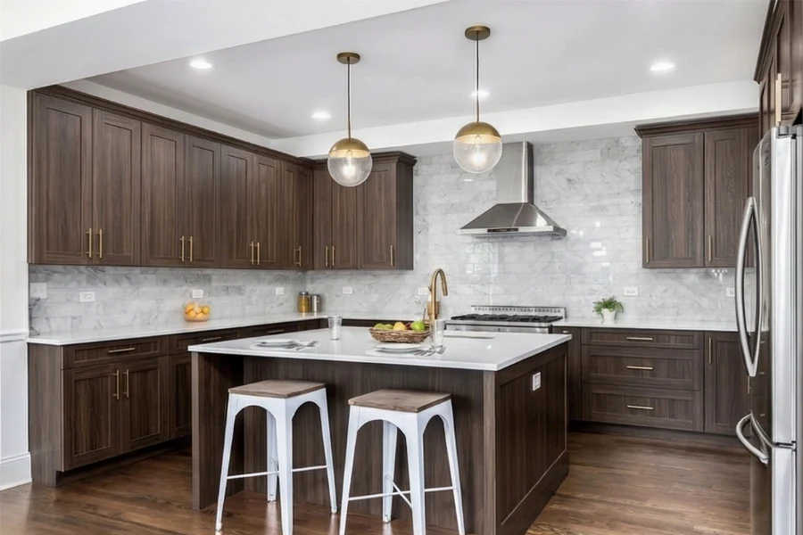 Contemporary freestanding counter with a waterfall edge design and a sturdy, monolithic silhouette that serves as a focal point