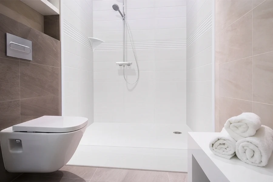 Minimalist practical shower station offering high-walled protection and an efficient, seamless watertight construction