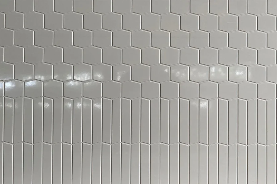 Modern vertical groove panel featuring an engineered solid-surface construction and a crisp, linear pattern that visually heightens interior spaces