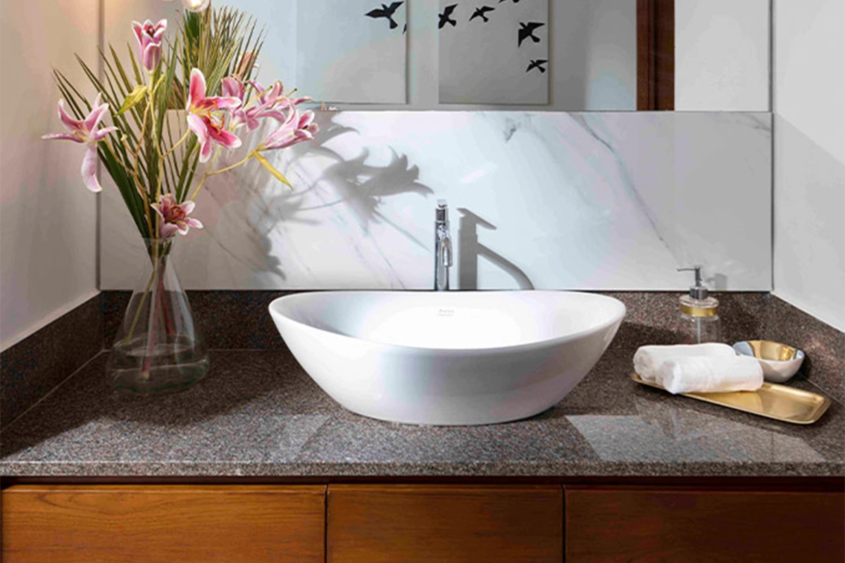 Modern classic countertop basin with a deep, rounded bowl and a high-gloss white ceramic finish.