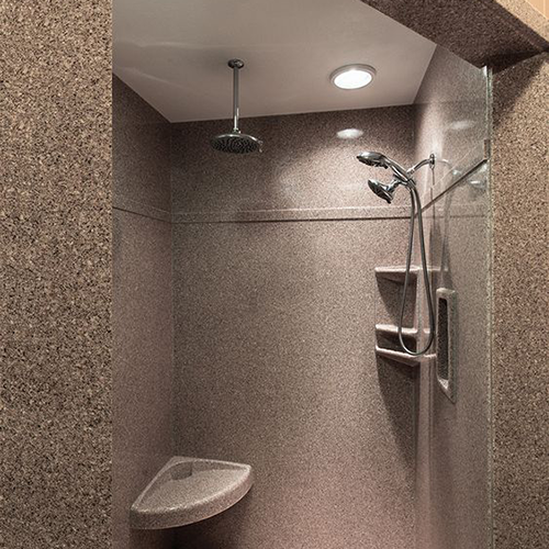 Premium granite shower surround with built-in seat for comfort