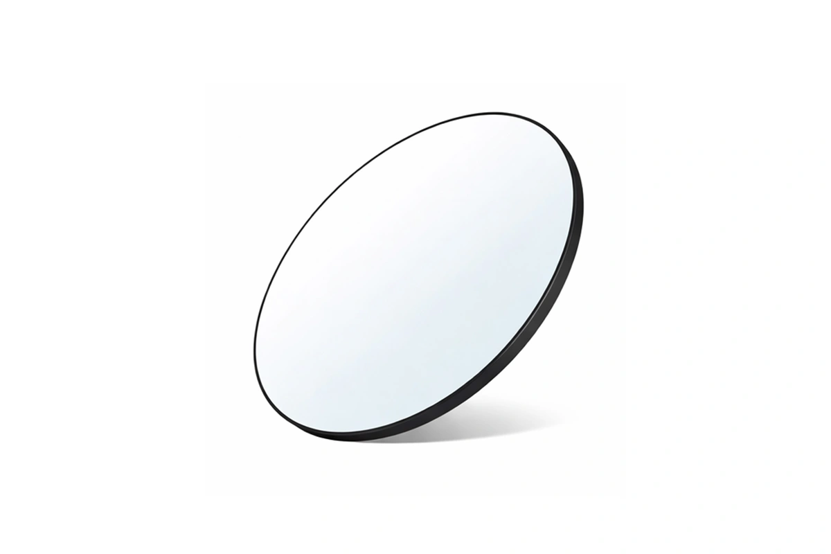 Elegant frameless-look round mirror for high-end resort ensuites and commercial interiors