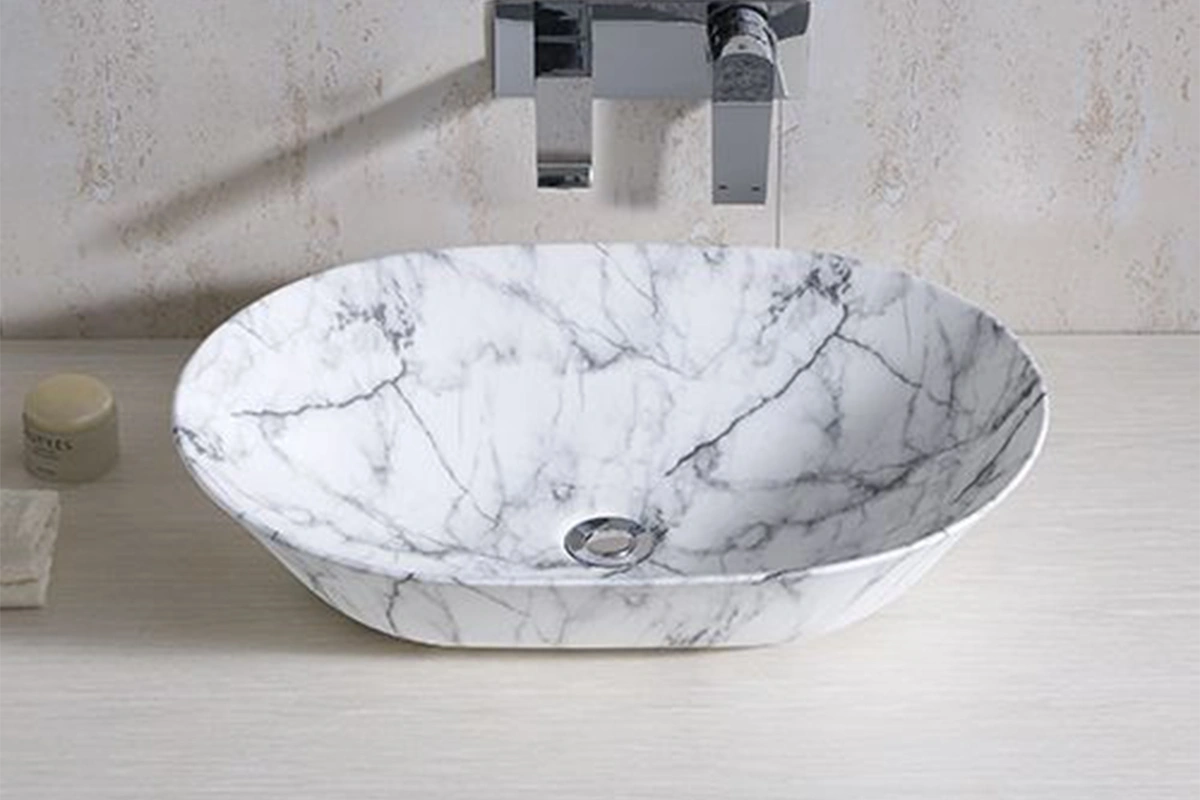 Modern round vessel sink featuring a tactile, hand-carved outer texture and a smooth interior basin