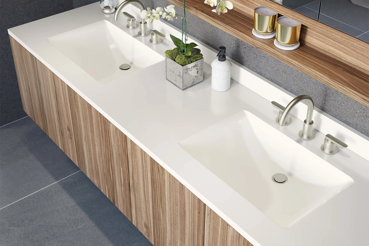 Sleek all-in-one vanity surface featuring a seamless transition from the countertop into a gently sloping integrated basin