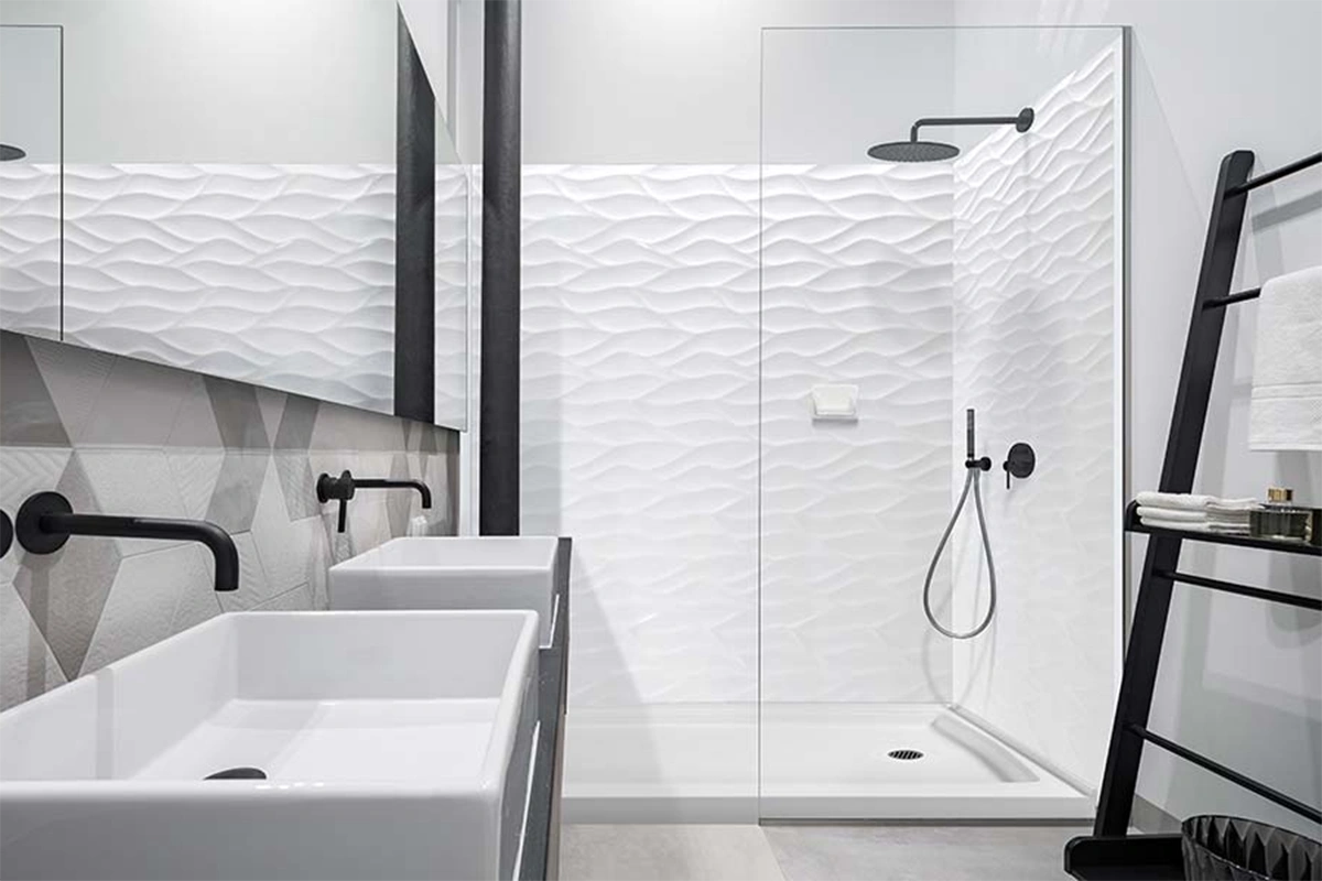 Sleek architectural glass-ready surround showcasing grout-free panels that provide a clean, high-contrast backdrop behind transparent shower walls