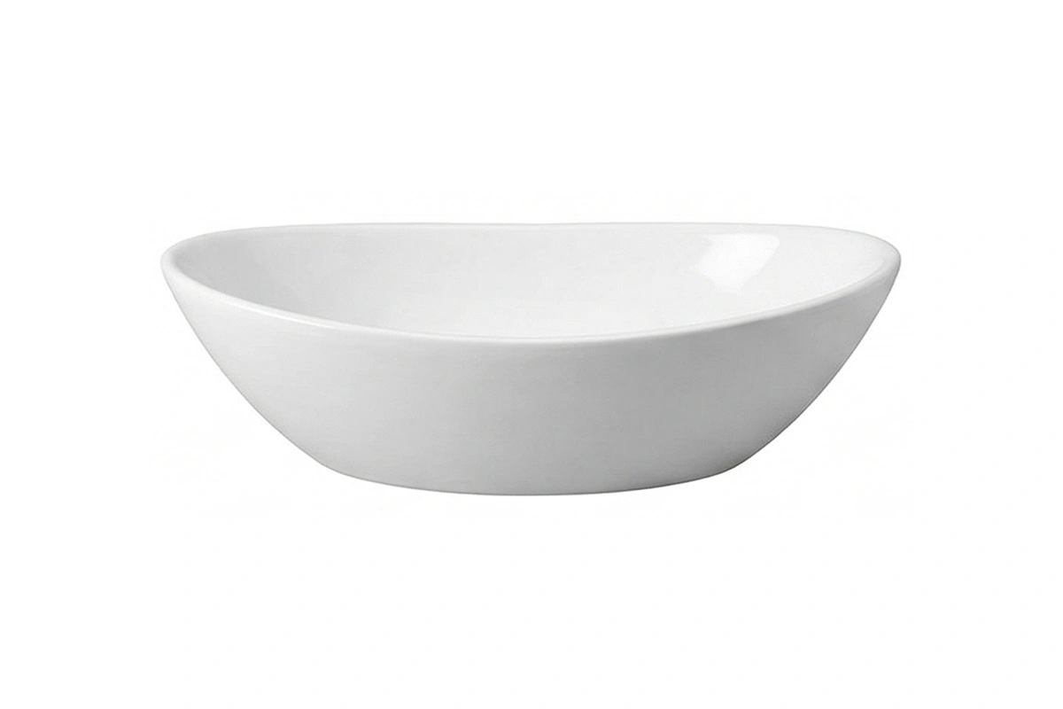 Sleek oval washbasin designed to sit atop a vanity, featuring a traditional silhouette and smooth edges