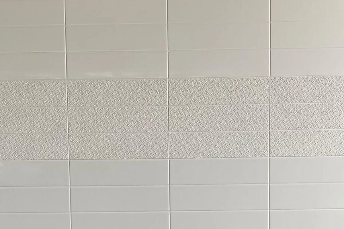A cultured marble wall panel designed for hotel shower surrounds, suite bathroom renovations, and hospitality installations - where large-format tile aesthetics are required without the grout maintenance that real tile installations demand.