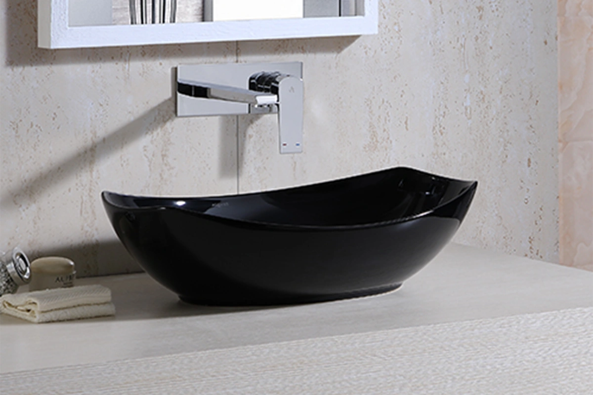 Modern round vessel sink with a sleek, thin-edged profile sitting atop a bathroom vanity