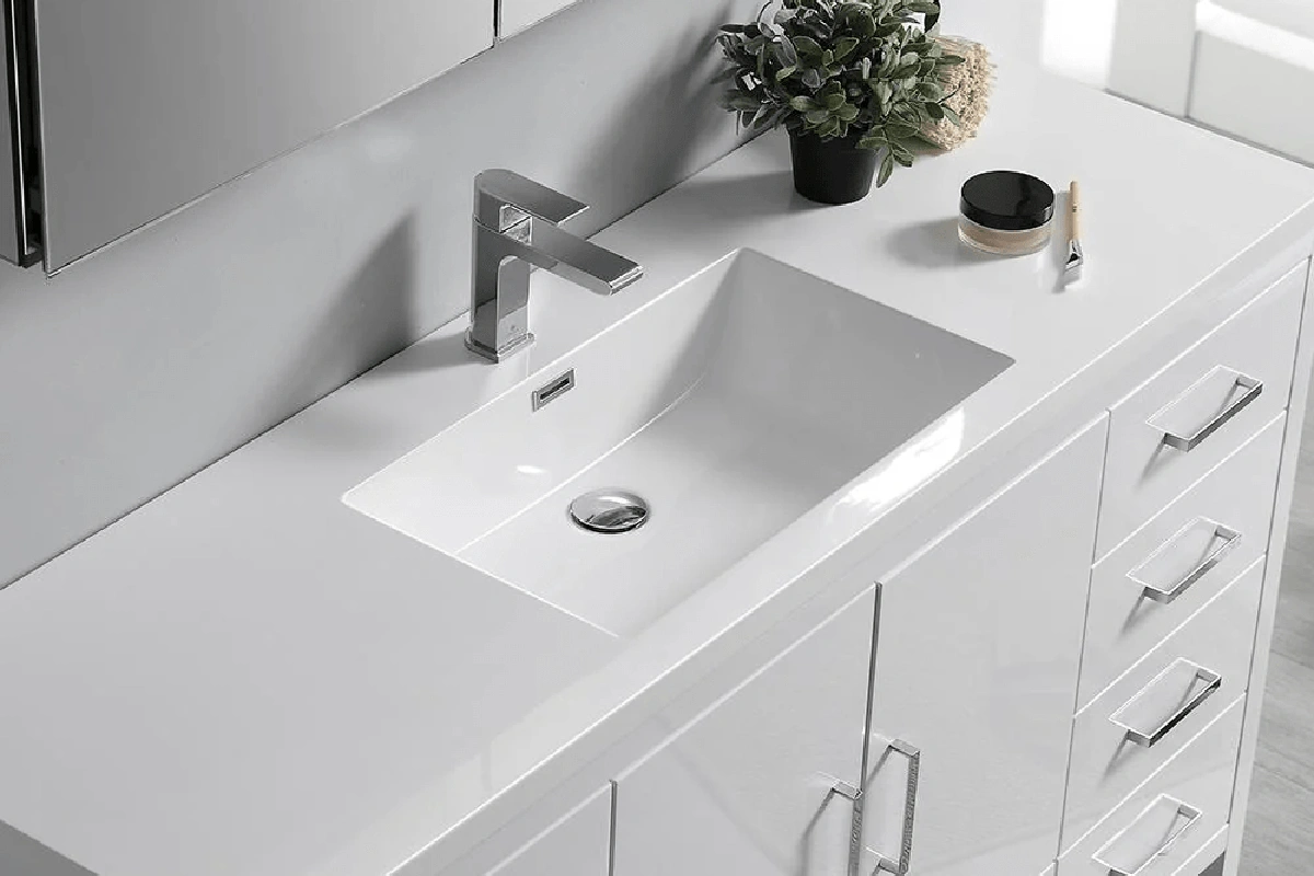 High-end granite vanity surface featuring a thick, double-mitered edge and a deep, high-gloss natural stone luster