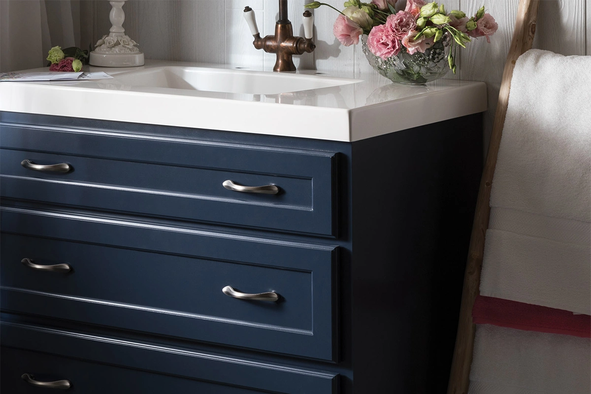 High-end granite vanity surface with a thick mitered edge and a sophisticated polished gray stone texture
