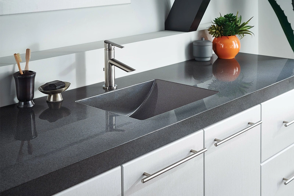 Sophisticated natural stone surface featuring a sleek, low-profile edge and a uniform salt-and-pepper grain