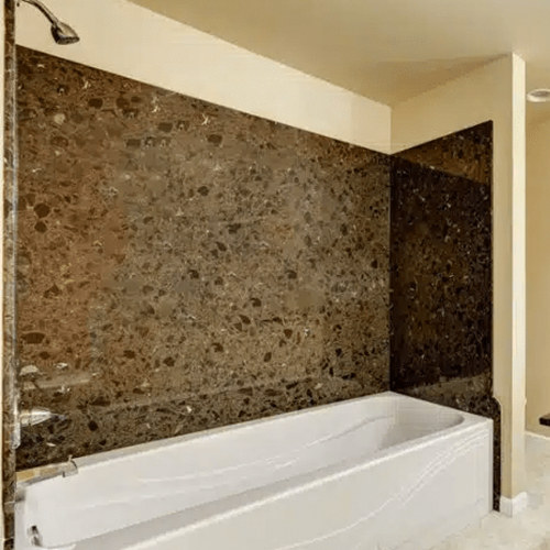 Luxury bathroom with full wall granite tub surround design