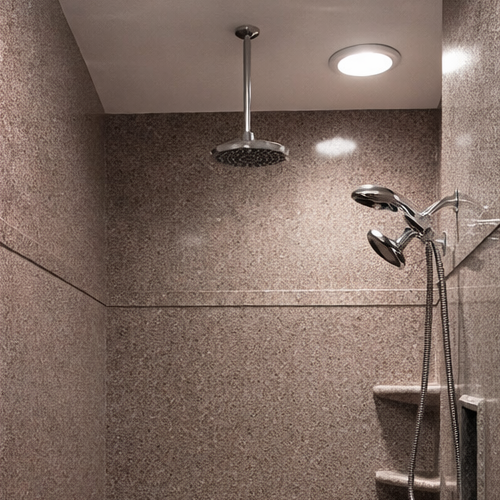 Built-in seat granite shower surround for modern bathroom upgrade