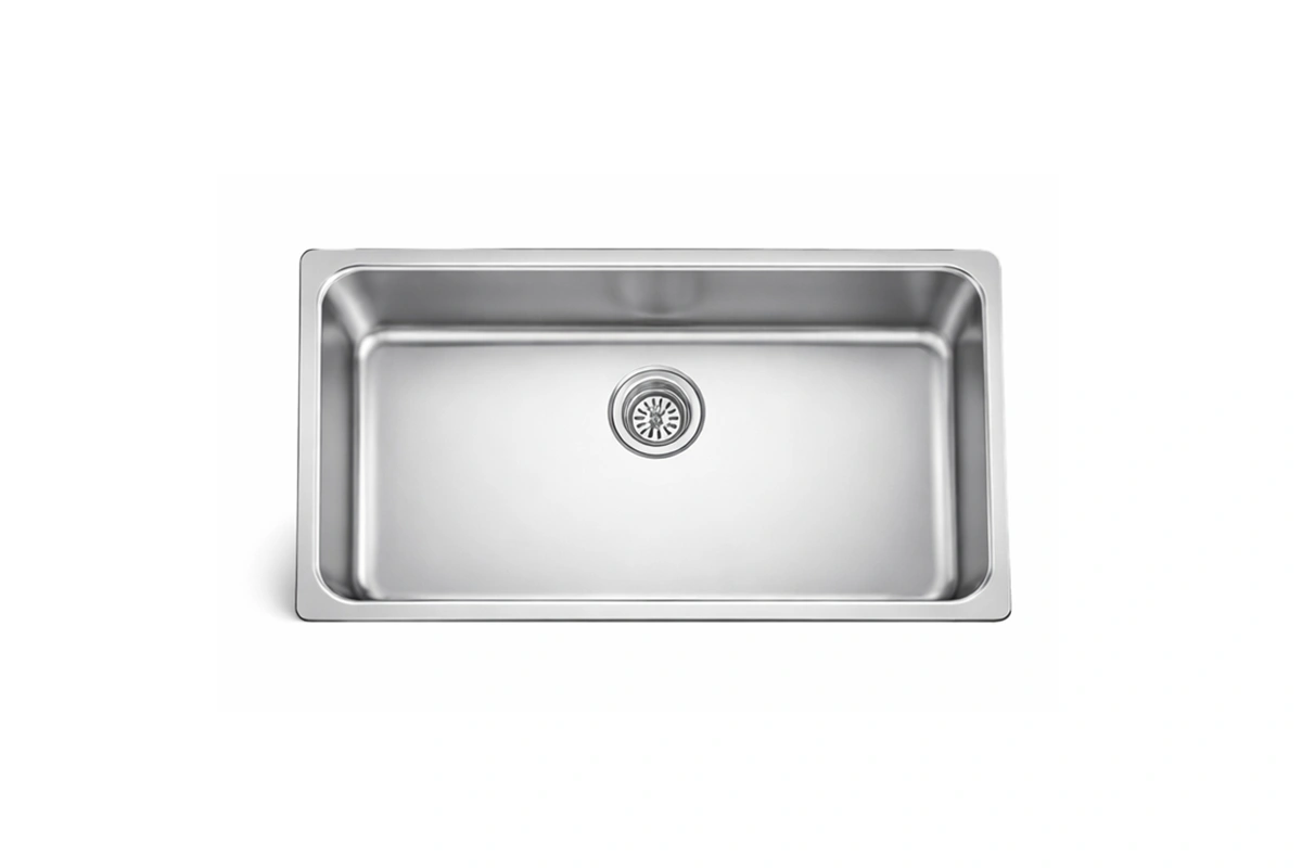 Industrial-style single bowl sink with a faceted interior base and a polished, brushed-metal finish