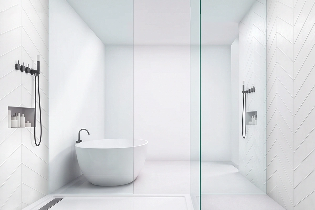 Sleek flush-mount shower surround showcasing a grout-free wall system designed to channel water efficiently into an exposed, wide-drain open basin